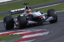Zak Brown in een klassieke McLaren