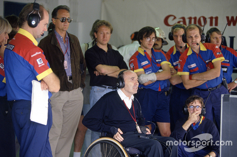 Adrian Newey, left, and Frank Williams watch the race action