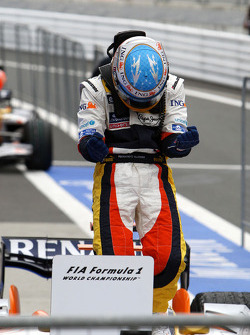 Race winner Fernando Alonso celebrates