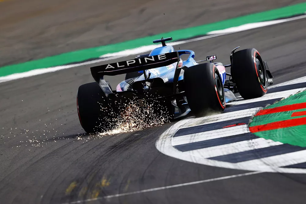 Fernando Alonso, Alpine A522, kicks up some sparks