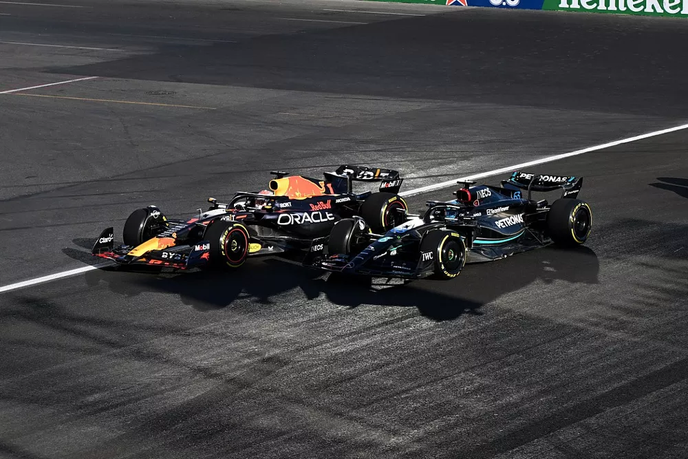 Max Verstappen, Red Bull Racing RB19, battles with George Russell, Mercedes F1 W14, ahead of Carlos Sainz, Ferrari SF-23