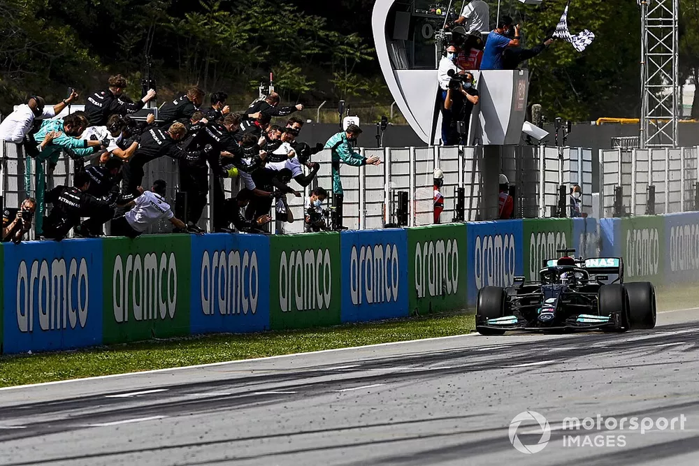 Race Winner Lewis Hamilton, Mercedes W12 crosses the finish line  