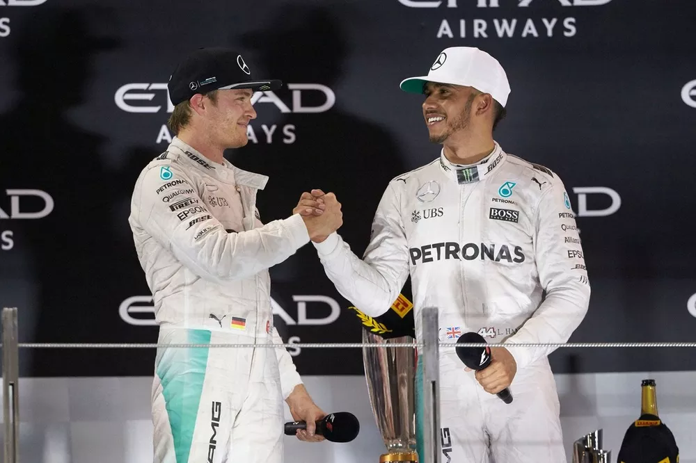 World Champion Nico Rosberg, Mercedes AMG F1 shakes hands with team mate and race winner Lewis Hamilton, Mercedes AMG F1
