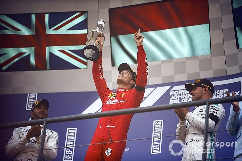 Charles Leclerc, Ferrari, celebrates on the podium with Lewis Hamilton, Mercedes AMG F1 and Valtteri Bottas, Mercedes AMG F1 