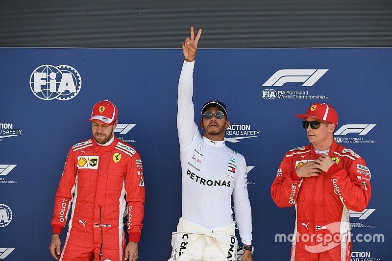 Sebastian Vettel, Ferrari, pole sitter Lewis Hamilton, Mercedes-AMG F1 and Kimi Raikkonen, Ferrari celebrate in parc ferme