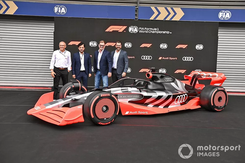 Stefano Domenicali, CEO, Formula 1, with Mohammed bin Sulayem, President, FIA, Oliver Hoffmann, Head of Technical Development at Audi Sport GmbH, Markus Duesmann, Chairman of the Board of Management of Audi AG showcase the new Audi Sport F1 concept car