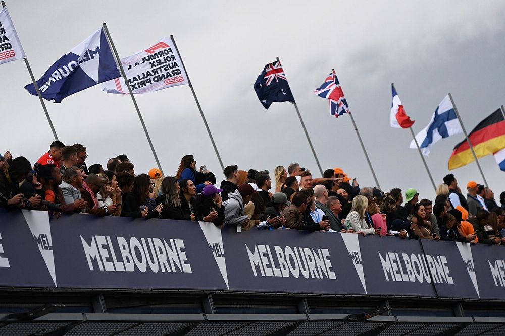 Fans watch from over the pit lane