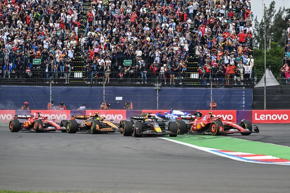 Max Verstappen, Red Bull Racing RB20, battles with Carlos Sainz, Ferrari SF-24, ahead of Lando Norris, McLaren MCL38, Charles Leclerc, Ferrari SF-24, the rest of the field as Yuki Tsunoda, RB F1 Team VCARB 01, crashes out on the opening lap