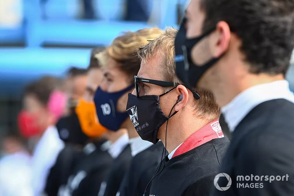 Kimi Raikkonen, Alfa Romeo, on the grid with the other drivers for the national anthem