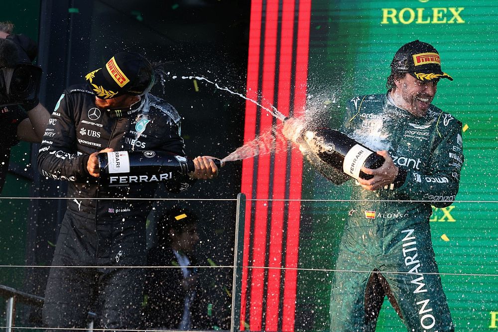 Lewis Hamilton, Mercedes-AMG, 2nd position, Fernando Alonso, Aston Martin F1 Team, 3rd position, spray Champagne on the podium
