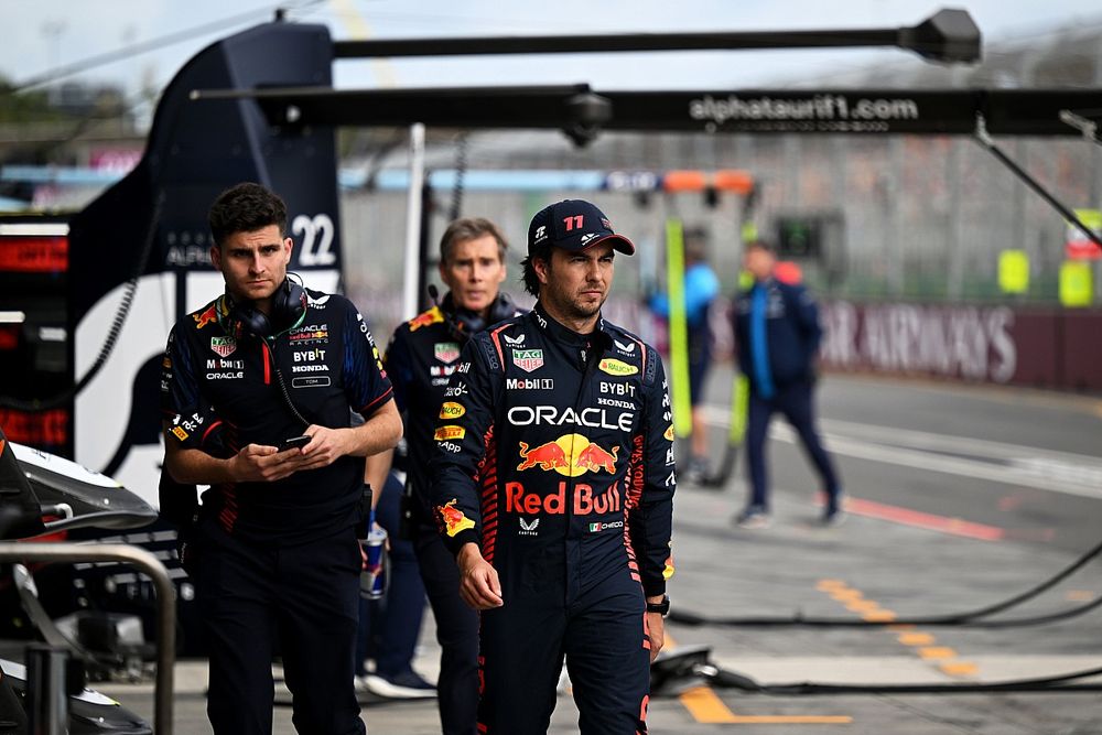 Sergio Perez, Red Bull Racing, heads to the garage after retiring in Q1