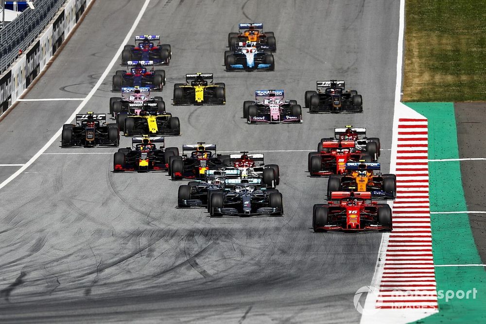 Charles Leclerc, Ferrari SF90, leads Valtteri Bottas, Mercedes AMG W10, Lewis Hamilton, Mercedes AMG F1 W10, Lando Norris, McLaren MCL34, Kimi Raikkonen, Alfa Romeo Racing C38, Sebastian Vettel, Ferrari SF90, Max Verstappen, Red Bull Racing RB15, and the rest of the field at the start