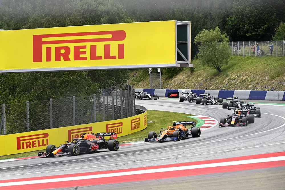 Max Verstappen, Red Bull Racing RB16B, Lando Norris, McLaren MCL35M, and Sergio Perez, Red Bull Racing RB16B