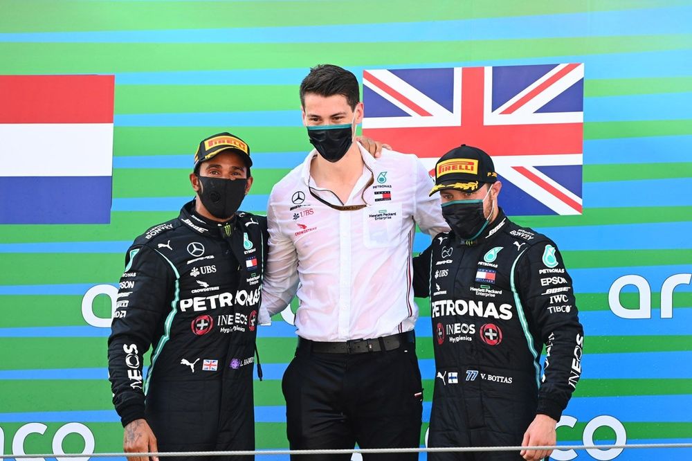 Lewis Hamilton, Mercedes-AMG Petronas F1, 1st position, Valtteri Bottas, Mercedes-AMG Petronas F1, 3rd position, with the Mercedes trophy delegate on the podium