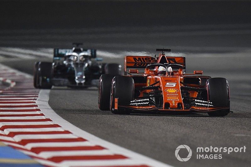 Sebastian Vettel, Ferrari SF90, leads Lewis Hamilton, Mercedes AMG F1 W10