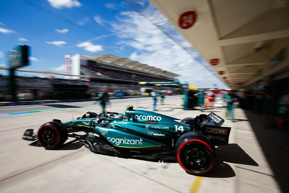 Fernando Alonso, Aston Martin AMR23, leaves the garage