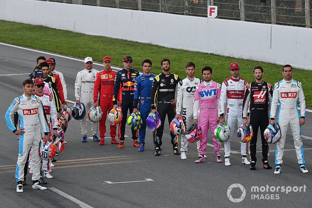 The drivers line up on the track