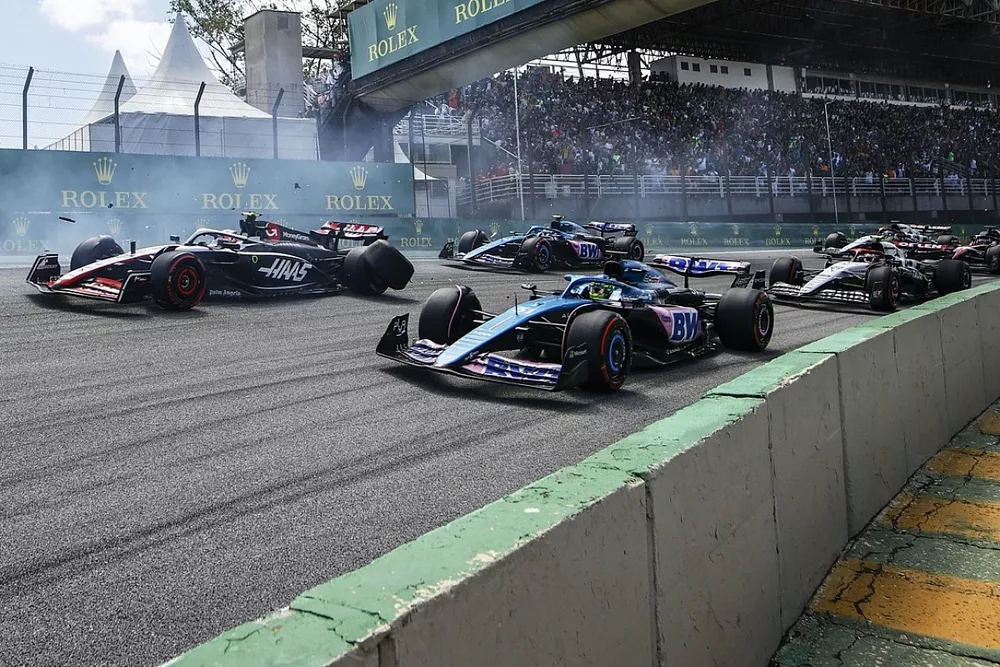 Kevin Magnussen, Haas VF-23, crashes out at the start after contact with Alex Albon, Williams FW45