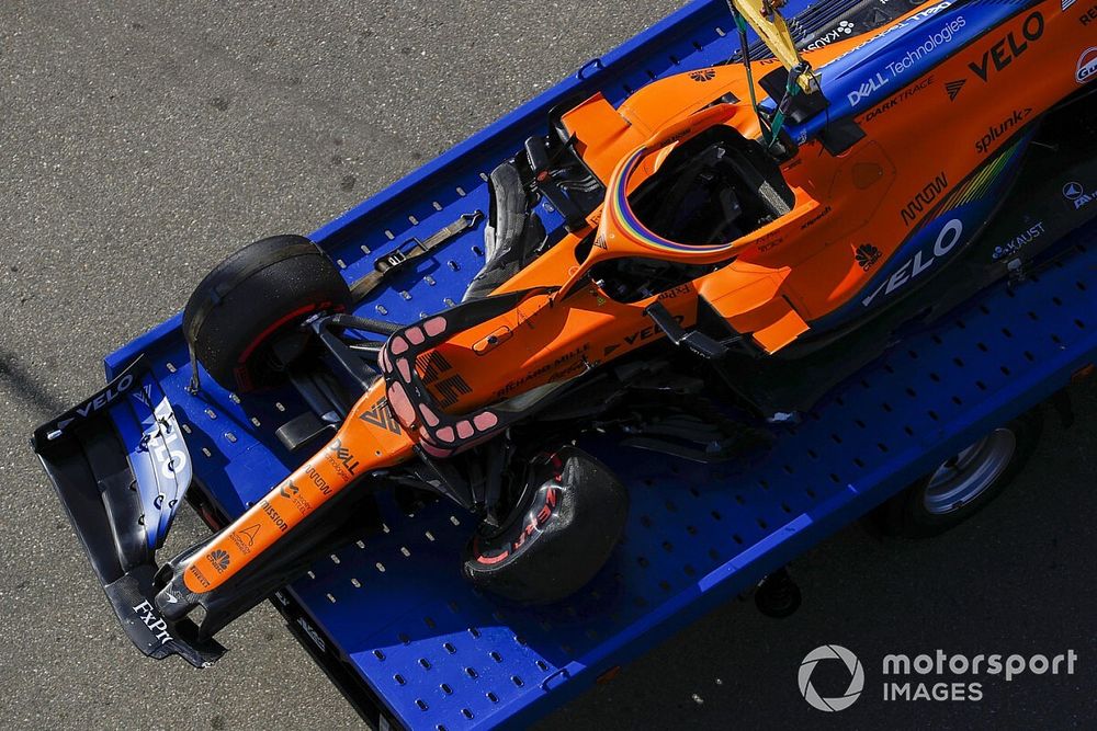 The damaged car of Carlos Sainz Jr., McLaren MCL35, on a truck