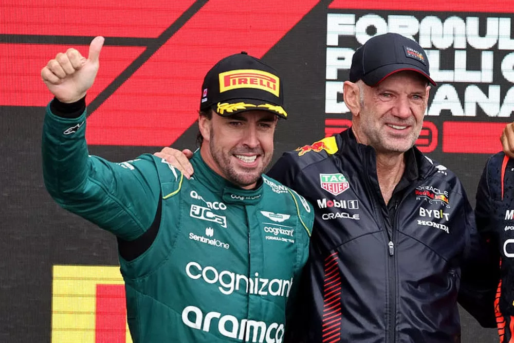 Fernando Alonso, Aston Martin F1 Team, 2nd position, Adrian Newey, Chief Technology Officer, Red Bull Racing, Max Verstappen, Red Bull Racing, 1st position, Lewis Hamilton, Mercedes-AMG, 3rd position, on the podium