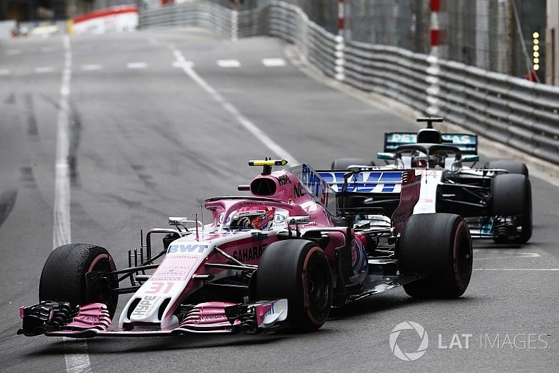 Esteban Ocon, Force India VJM11, leads Lewis Hamilton, Mercedes AMG F1 W09