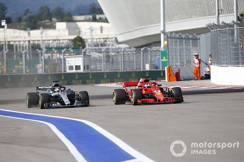 Sebastian Vettel, Ferrari SF71H, passes Lewis Hamilton, Mercedes AMG F1 W09 