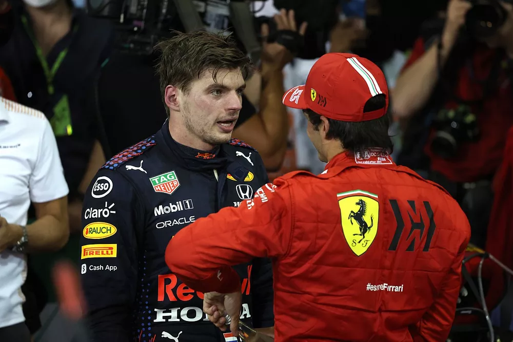Carlos Sainz Jr., Ferrari, 3rd position, congratulates Max Verstappen, Red Bull Racing, 1st position, in Parc Ferme