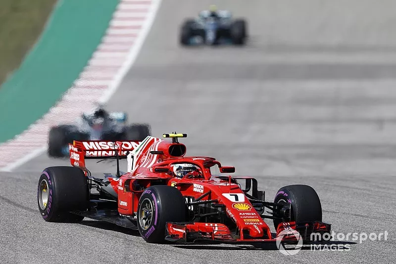 Kimi Raikkonen, Ferrari SF71H, leads Lewis Hamilton, Mercedes AMG F1 W09 EQ Power+