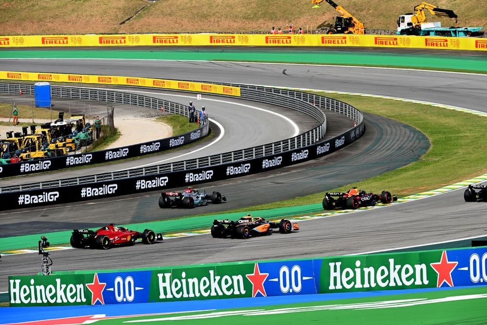Lewis Hamilton, Mercedes W13, on the infield after contact with Max Verstappen, Red Bull Racing RB18