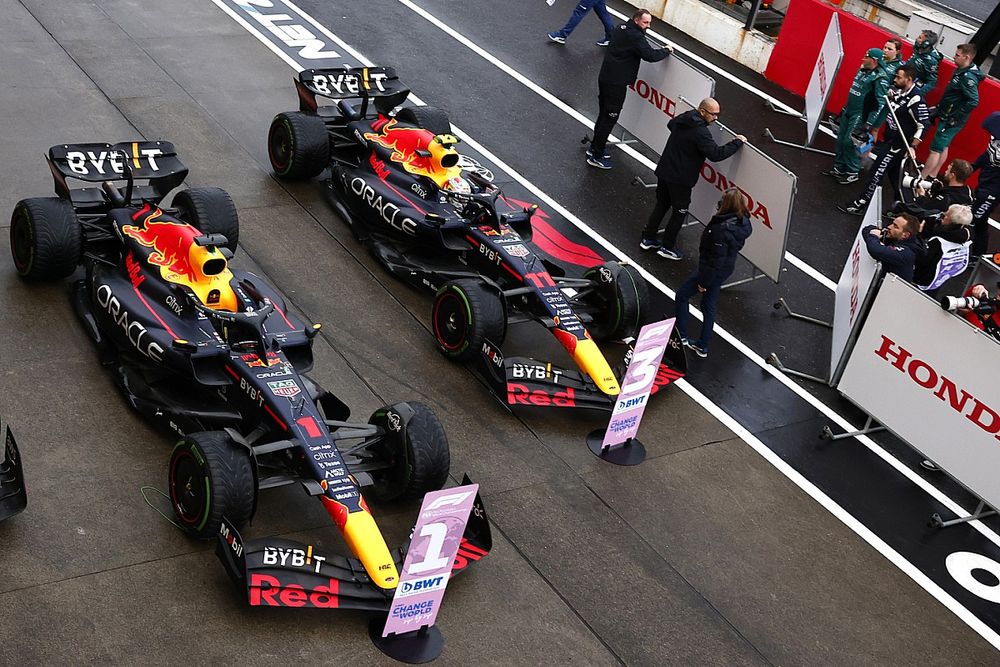 Sergio Perez, Red Bull Racing RB18, 2nd position, Charles Leclerc, Ferrari, 3rd position, in Parc Ferme