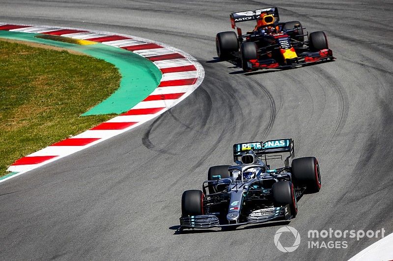 Valtteri Bottas, Mercedes AMG W10, leads Max Verstappen, Red Bull Racing RB15