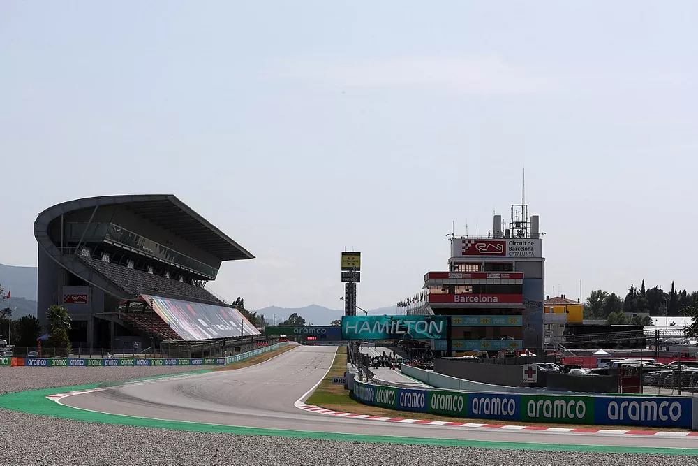 A crowd gathers in Parc Ferme after Qualifying