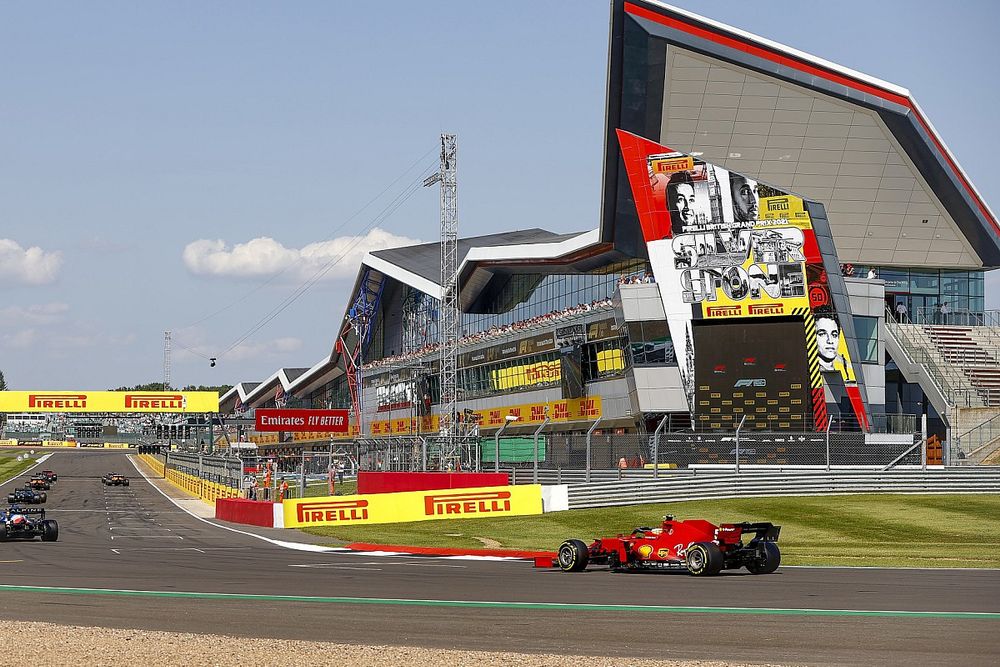 Fernando Alonso, Alpine A521, and Carlos Sainz Jr., Ferrari SF21, take their places on the grid for the restart