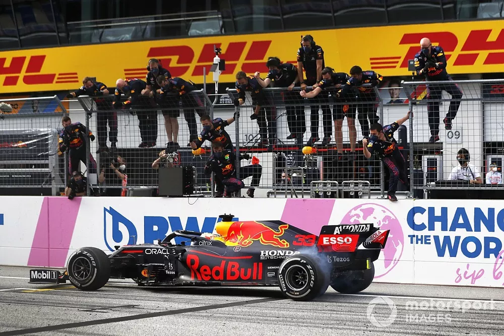 Max Verstappen, Red Bull Racing RB16B, crosses the line to win the race