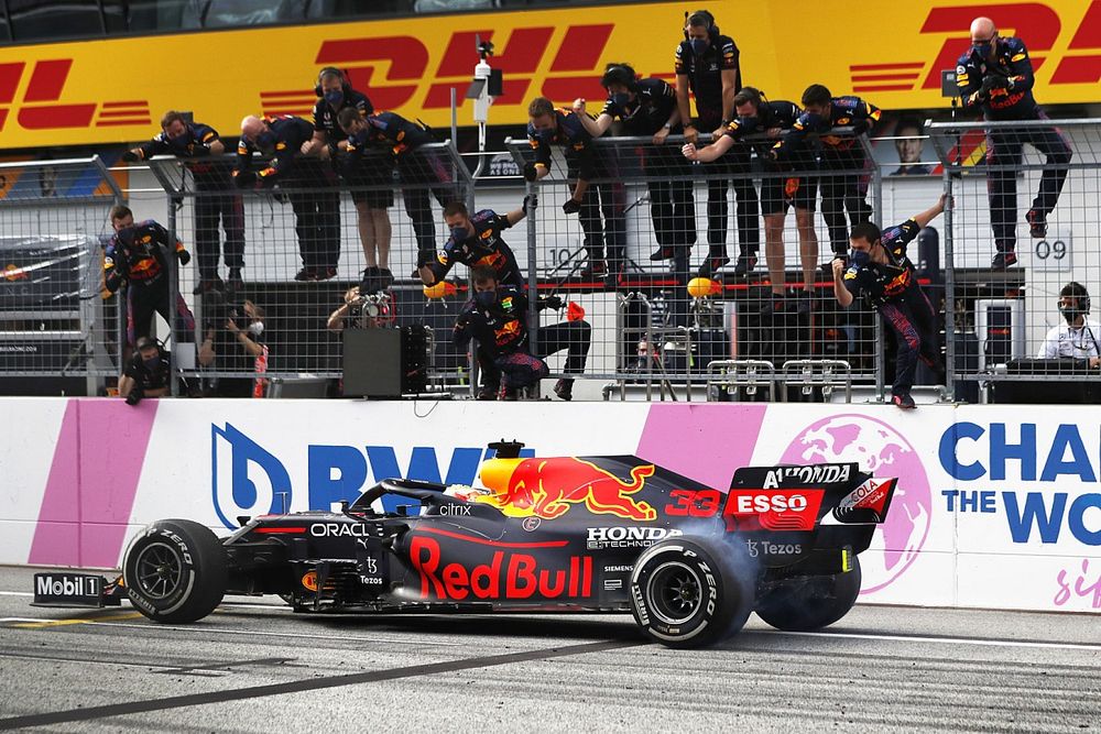 Max Verstappen, Red Bull Racing RB16B, crosses the line to win the race