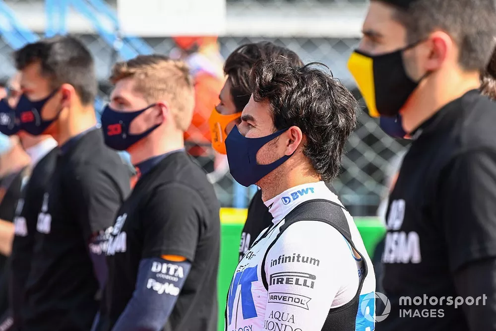 Sergio Perez, Racing Point, stands with the other drivers on the grid prior to the start