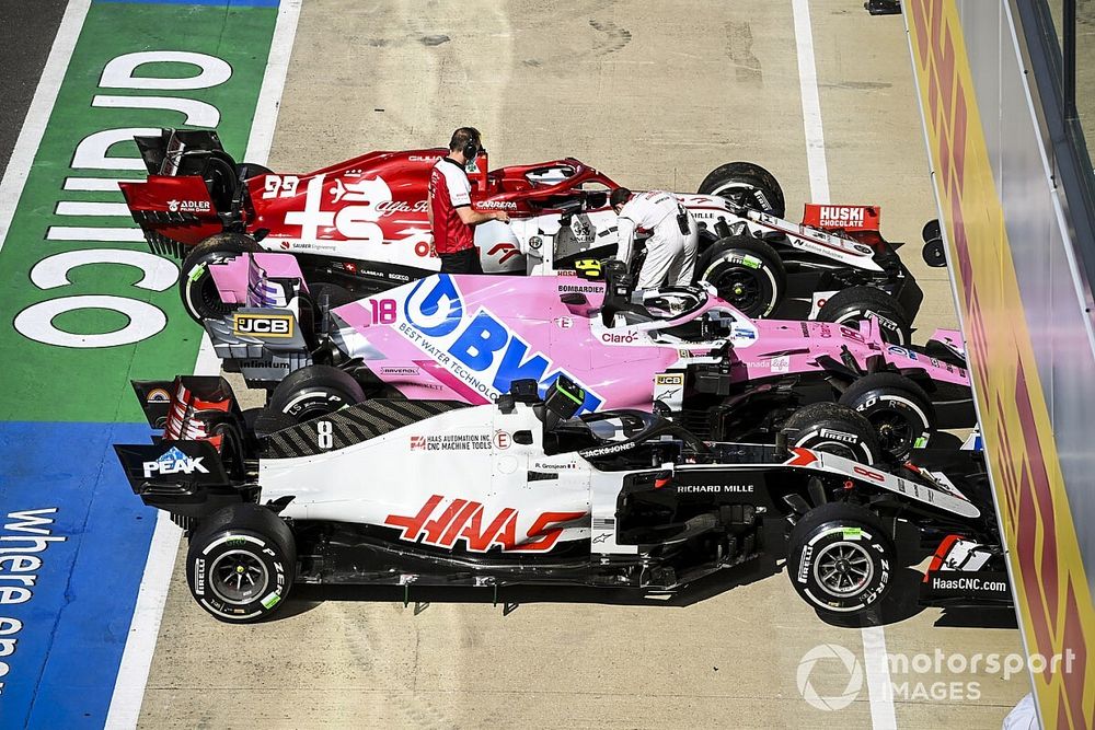 The cars of Romain Grosjean, Haas VF-20, Lance Stroll, Racing Point RP20, and Antonio Giovinazzi, Alfa Romeo Racing C39, in Parc Ferme