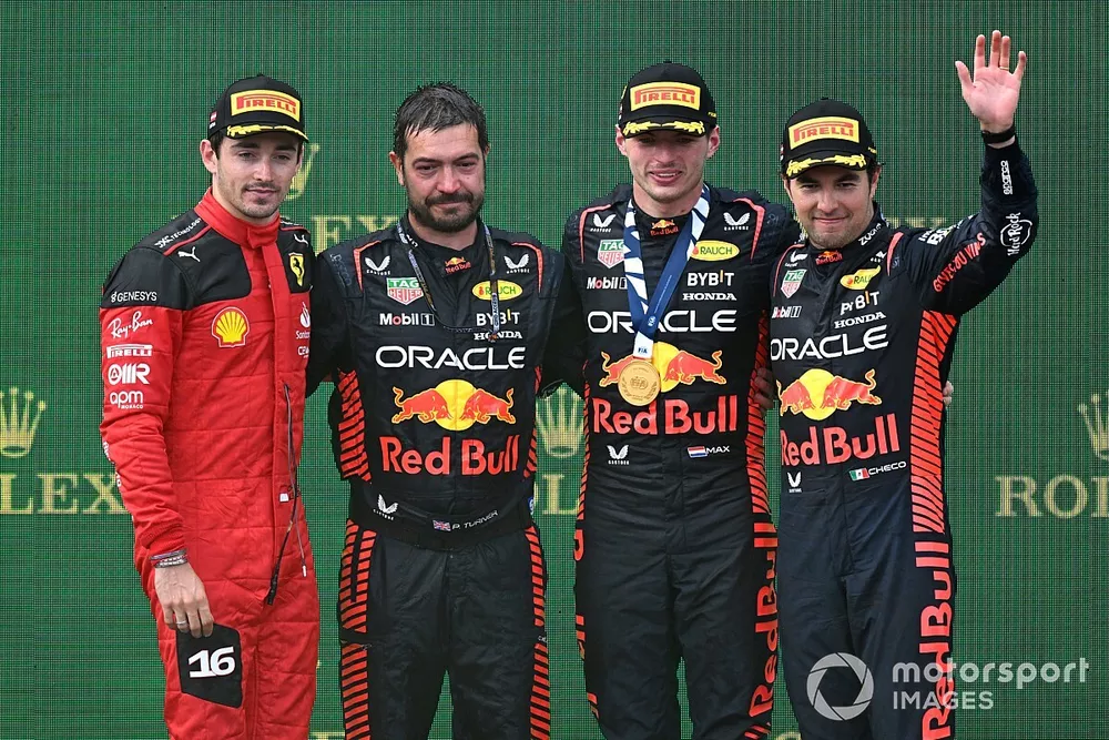 Charles Leclerc, Scuderia Ferrari, 2nd position, the Red Bull trophy delegate, Max Verstappen, Red Bull Racing, 1st position, Sergio Perez, Red Bull Racing, 3rd position, on the podium