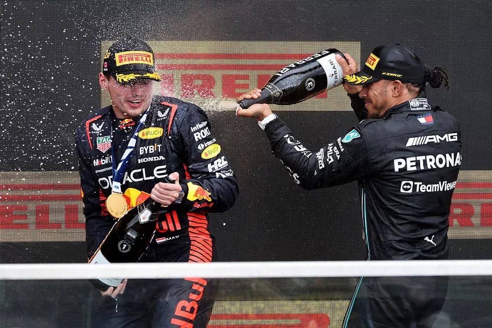 Max Verstappen, Red Bull Racing, 1st position, Lewis Hamilton, Mercedes-AMG, 3rd position, spray Champagne on the podium