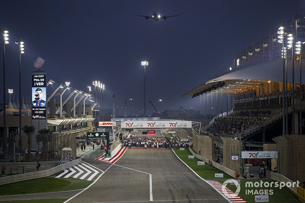 A Gulf Air Boeing 787-9 Dreamliner flies over the grid prior to the start