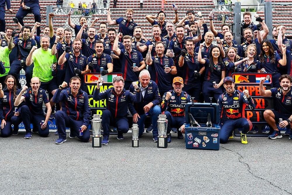 Max Verstappen, Sergio Perez celebrate with Red Bull Racing team members