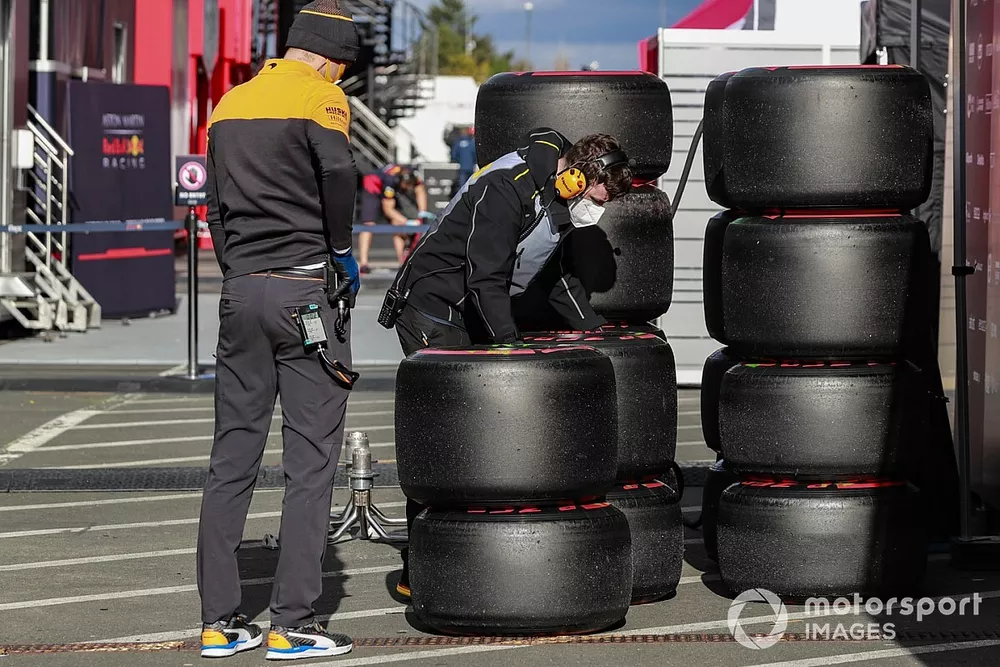 Mechanics work on some tyres