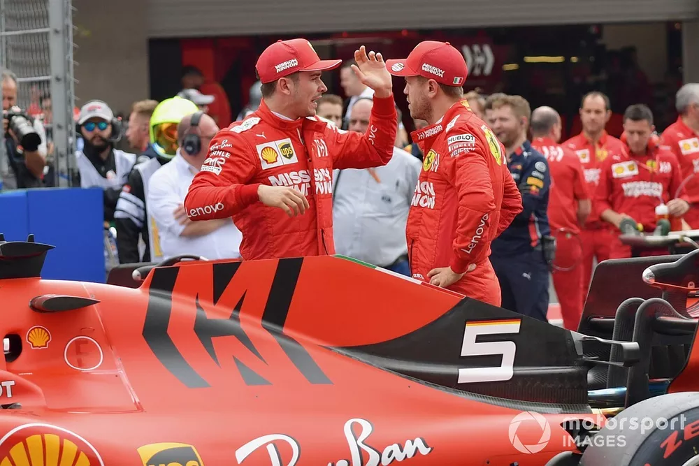 Charles Leclerc, Ferrari, and Sebastian Vettel, Ferrari, talk after Qualifying