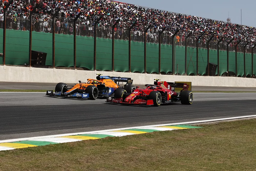 Lando Norris, McLaren MCL35M, battles with Carlos Sainz Jr., Ferrari SF21