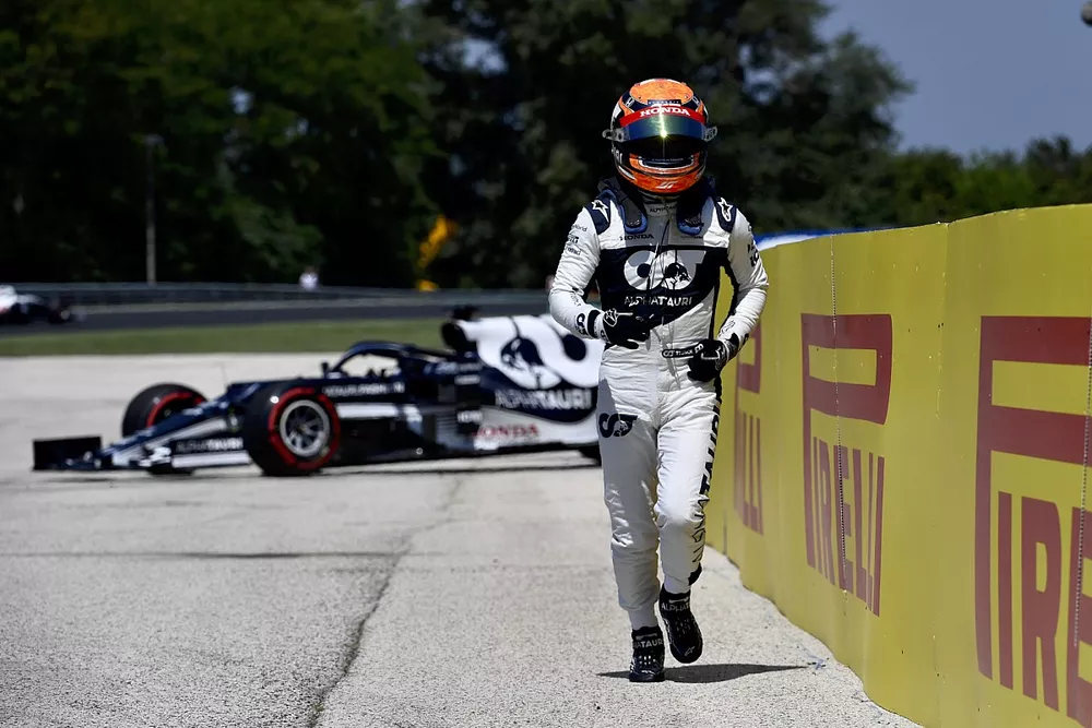 Yuki Tsunoda, AlphaTauri, walks away from his car after spinning out in practice