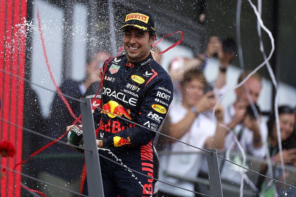 Sergio Perez, Red Bull Racing, 3rd position, sprays Champagne on the podium