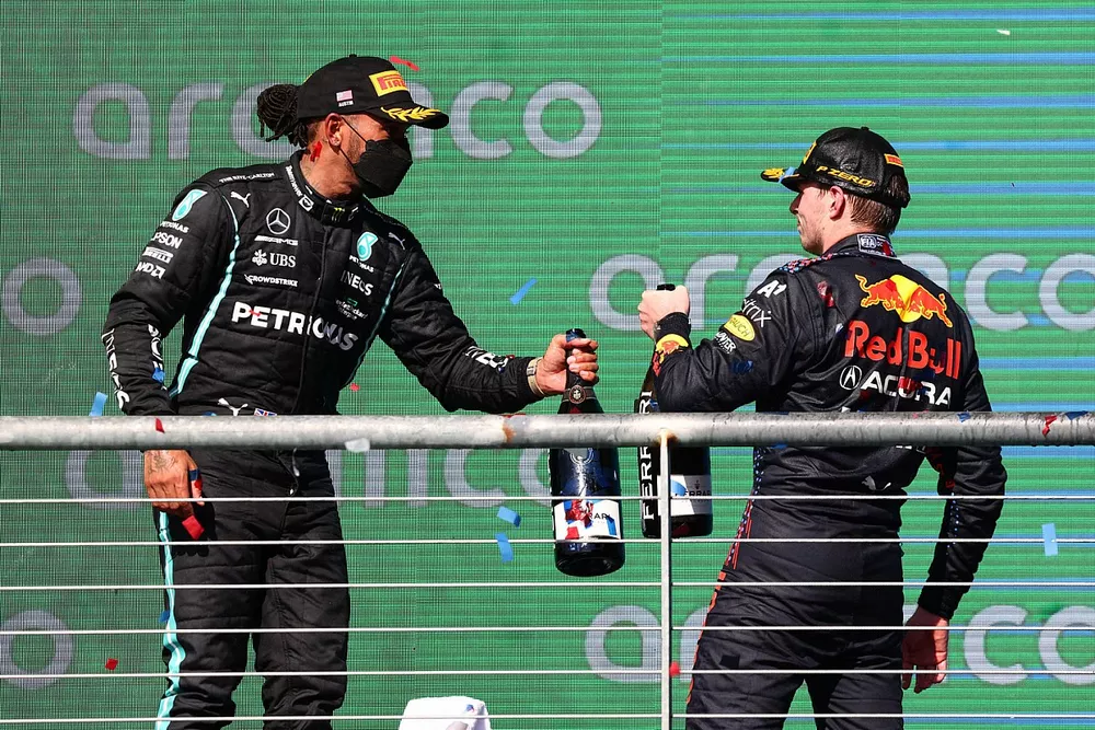 Lewis Hamilton, Mercedes, 2nd position, and Max Verstappen, Red Bull Racing, 1st position, congratulate each other on the podium