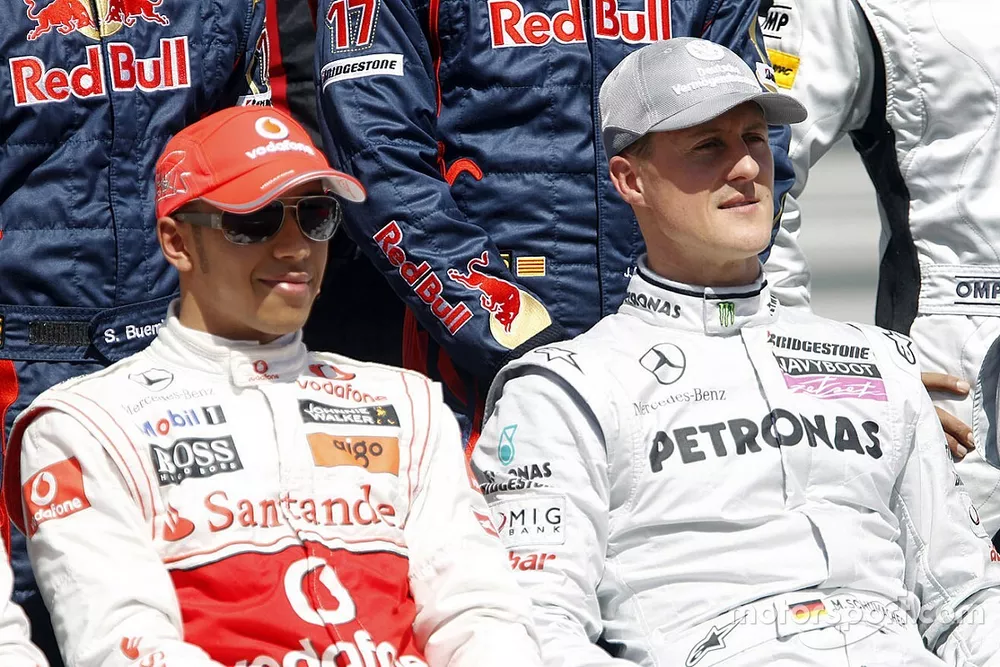 Lewis Hamilton, McLaren MP4-25, with Michael Schumacher, Mercedes GP W01