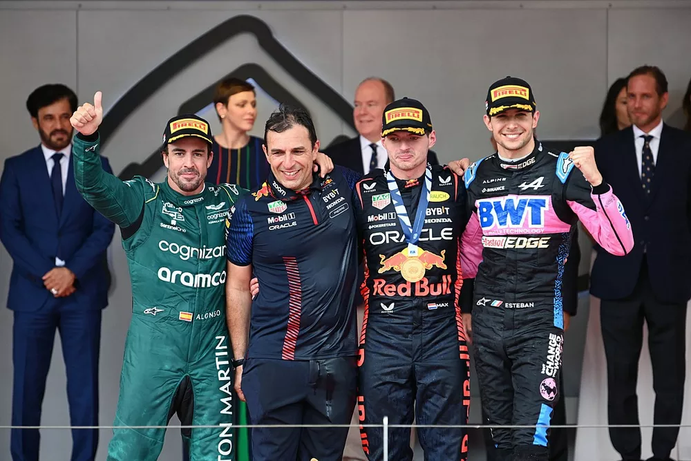 Fernando Alonso, Aston Martin F1 Team, 2nd position, the Red Bull trophy delegate, Max Verstappen, Red Bull Racing, 1st position, Esteban Ocon, Alpine F1 Team, 3rd position, on the podium