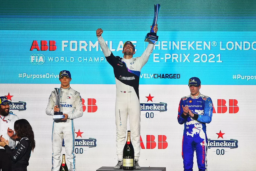 Jake Dennis, BMW I Andretti Motorsport, first position, lifts the winners trophy